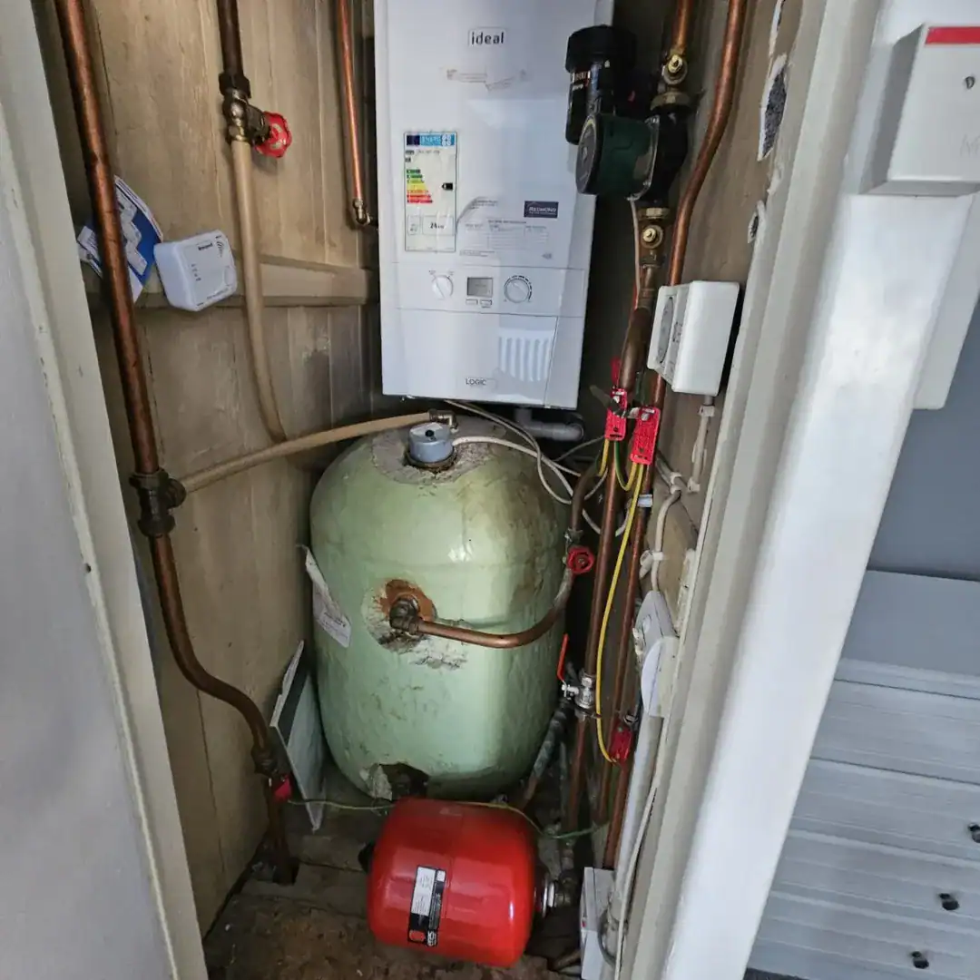 Boiler and hot water tank inside a Drimnagh, Dublin 12 apartment, showing the heating system. – Ghar.ie property listing