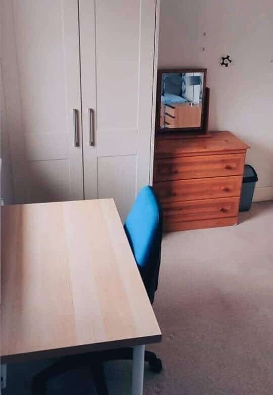 Single bedroom with wardrobe, desk, chair, and chest of drawers, available to rent. – Ghar.ie property listing