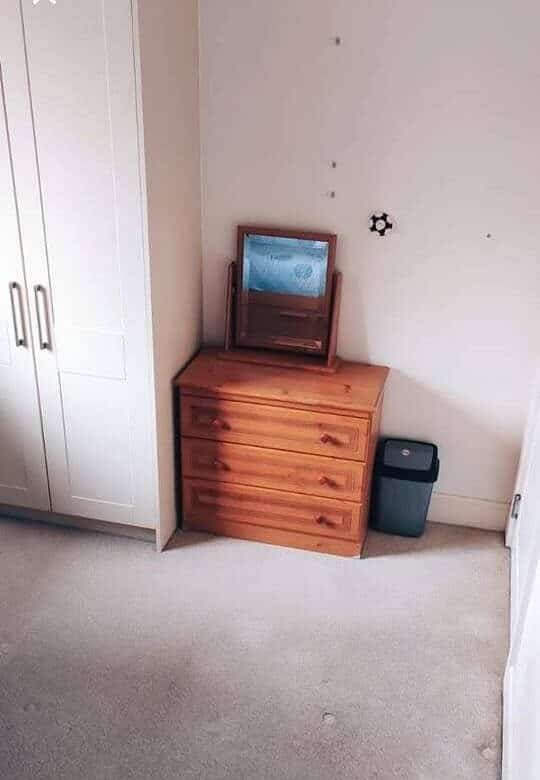 Bedroom interior showing a wardrobe, chest of drawers, mirror, and waste bin, suitable for single occupancy. – Ghar.ie property listing