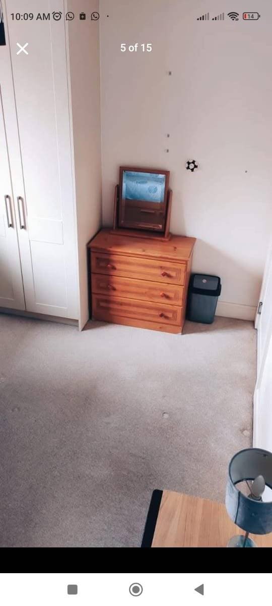 Bedroom interior showing a wardrobe, chest of drawers, mirror, and waste bin, suitable for single occupancy. – Ghar.ie property listing