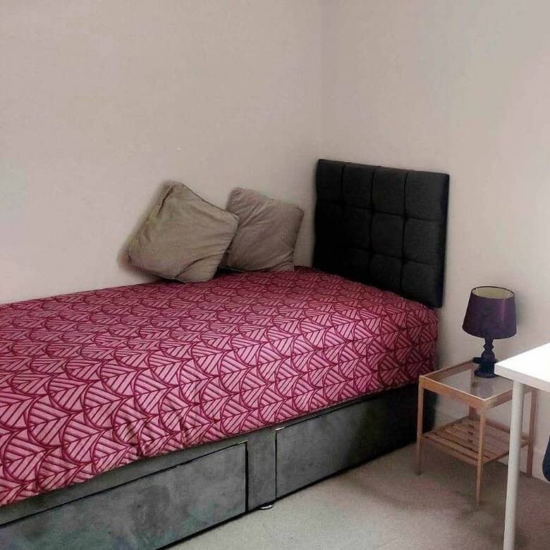 Single bedroom with bed, desk, chair, and window, available for private occupancy. – Ghar.ie property listing