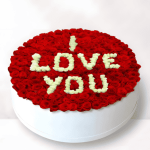 Red roses cake with "I Love You" message for romantic occasions.