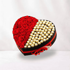 Heart-shaped box filled with red roses and Ferrero chocolates, perfect for romantic gifts.