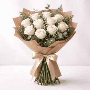 Elegant bouquet of white roses with greenery, perfect for special occasions.
