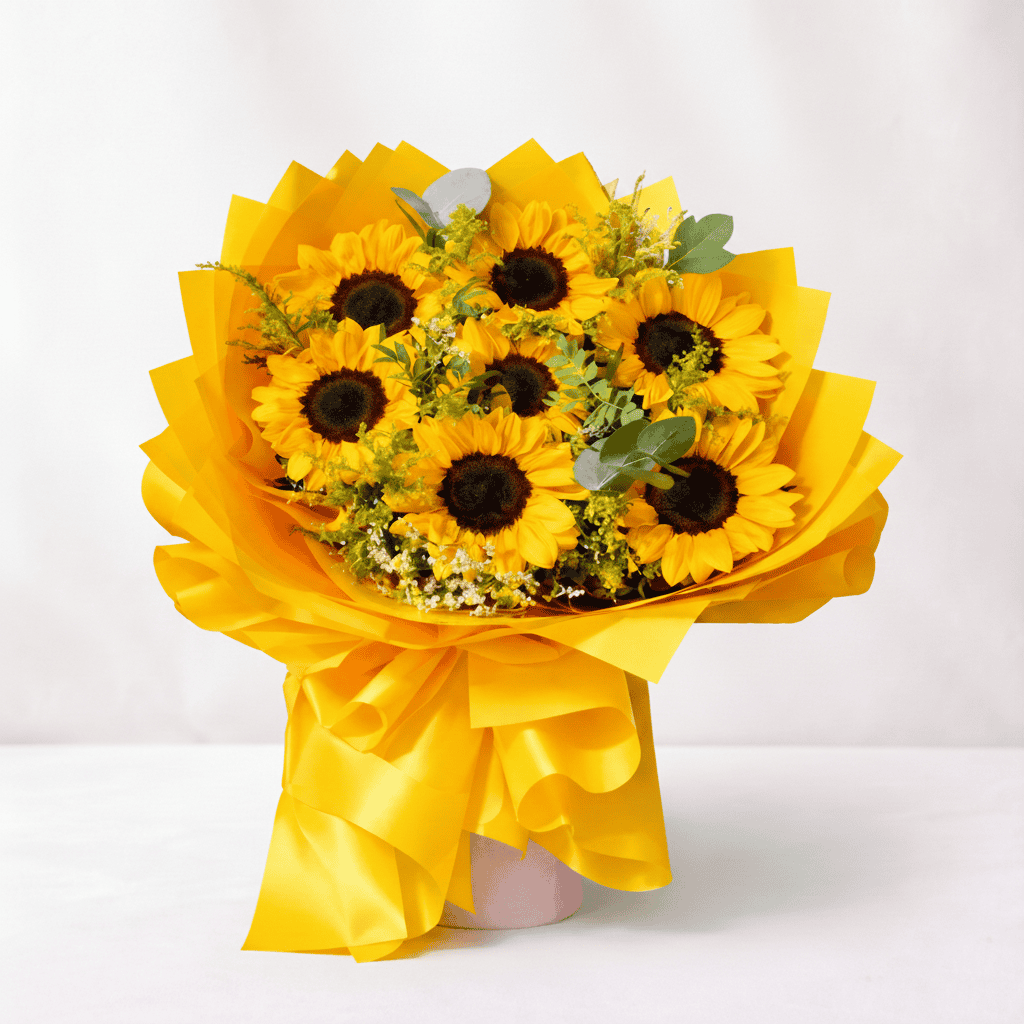 Vibrant sunflower bouquet with yellow petals and green foliage, perfect for cheerful occasions and b.