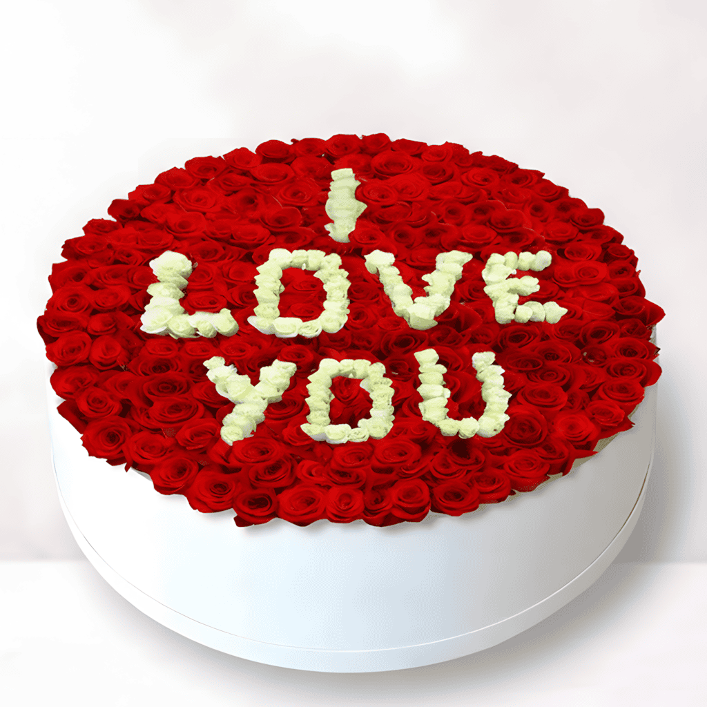 Red roses cake with "I Love You" message for romantic occasions.