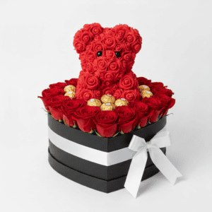 Shaped gift box filled with red roses, a teddy bear, and Ferrero chocolates for special occasions.