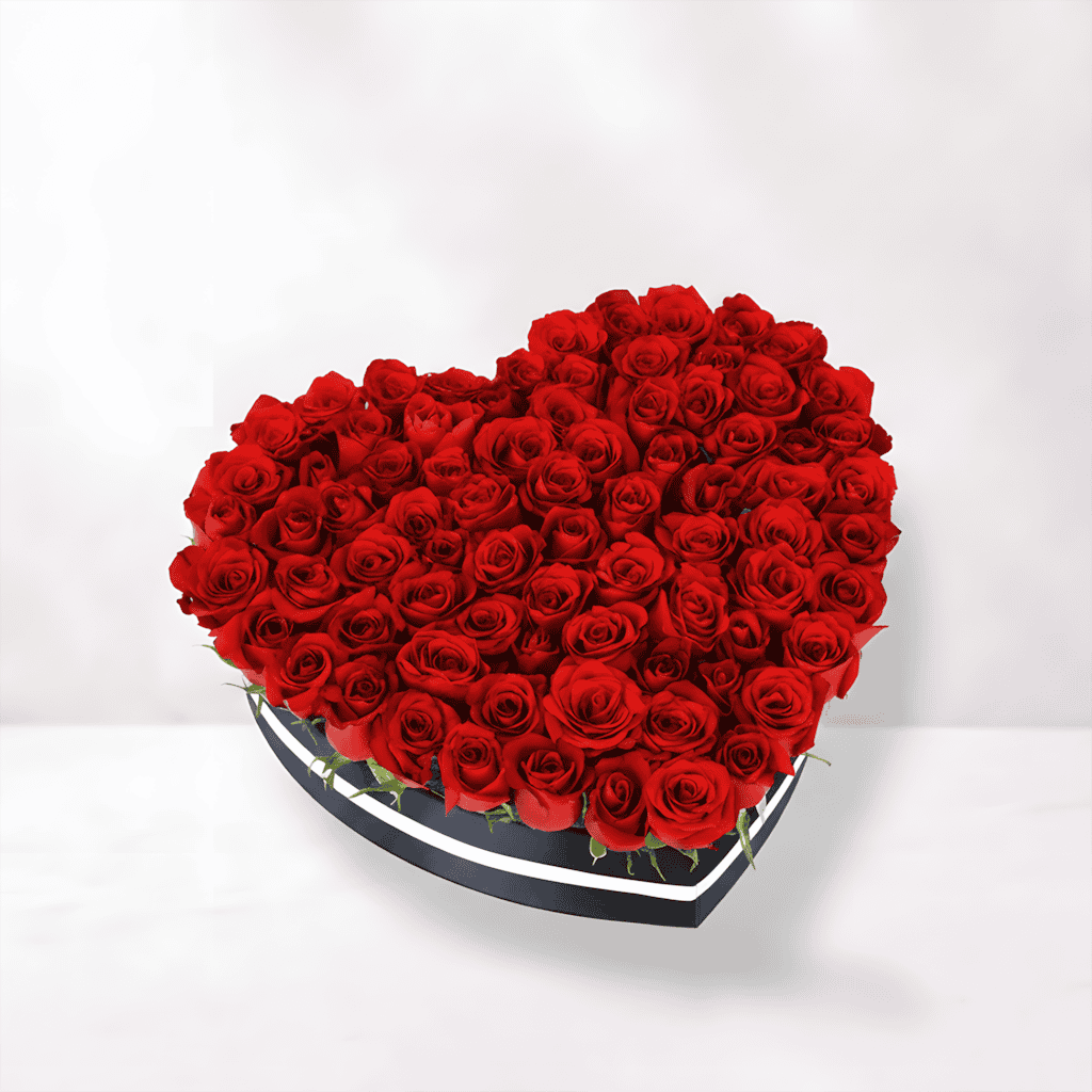 Heart-shaped box of vibrant red roses for love and romance.