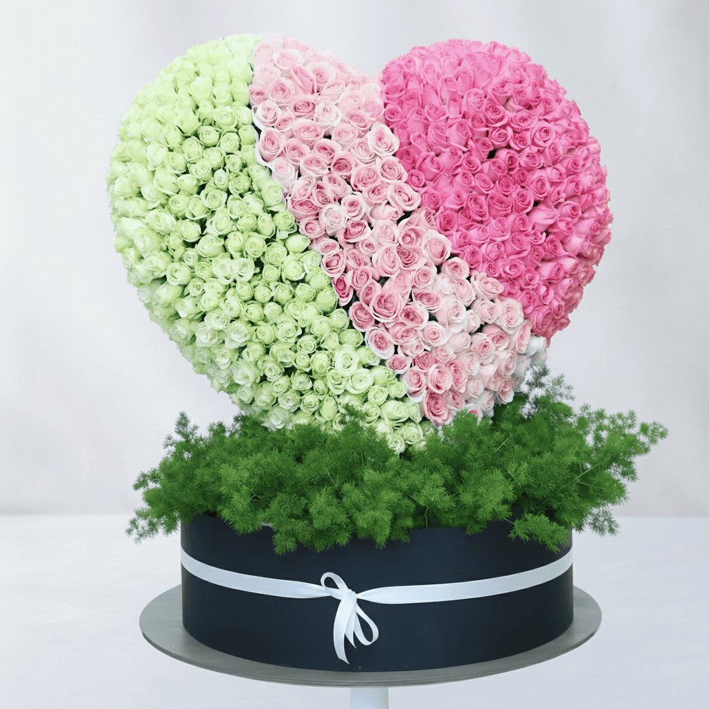 Shaped floral arrangement with pink and white roses, perfect for romantic occasions.