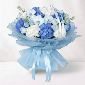 Elegant blue and white hydrangea, rose, and orchid floral arrangement for special occasions.