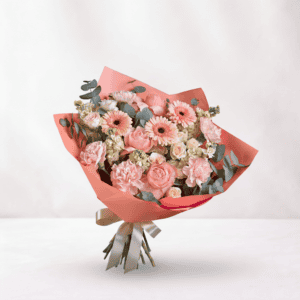 Pink floral bouquet with roses and gerbera daisies, wrapped in pink paper, symbolizing love and roma.