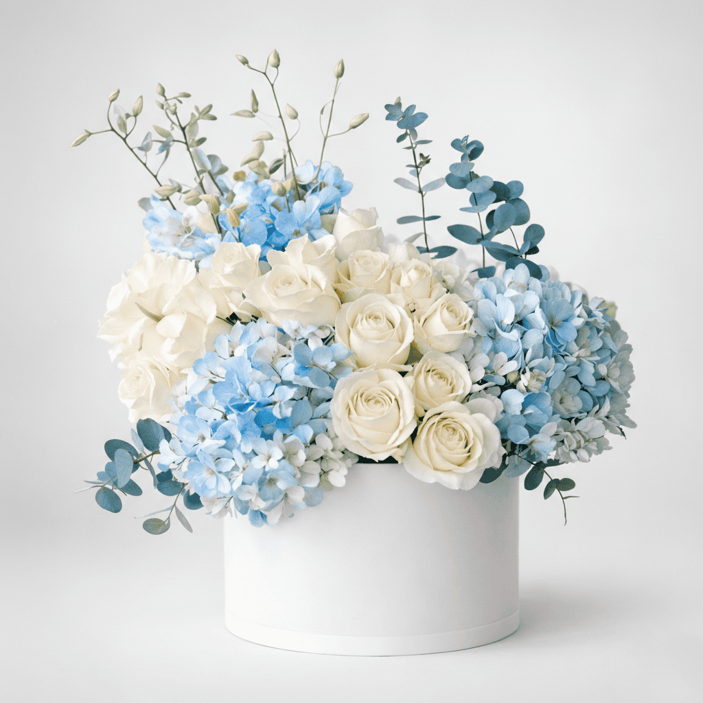 Beautiful hydrangea and white roses in a stylish white box, perfect for gifting or decor.
