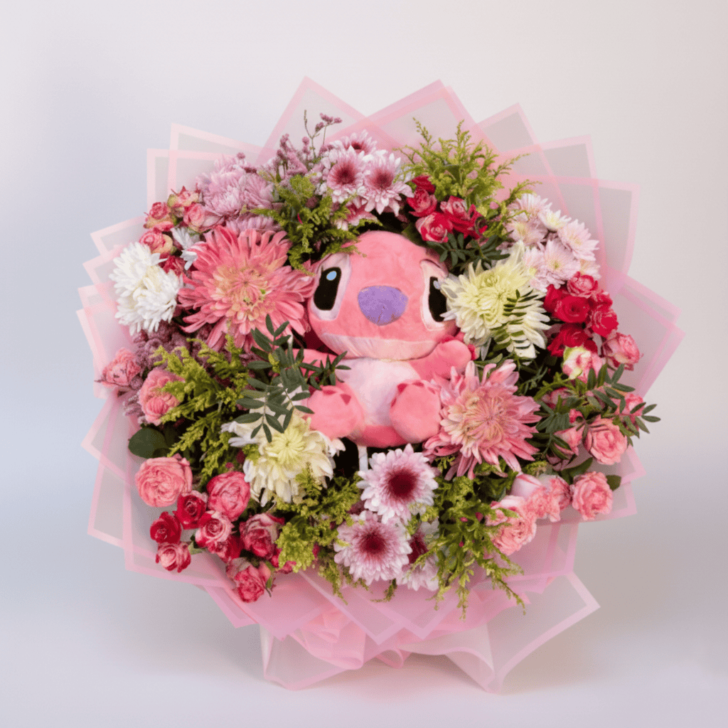 Pink flower and plush Stitch arrangement for floral gifts.
