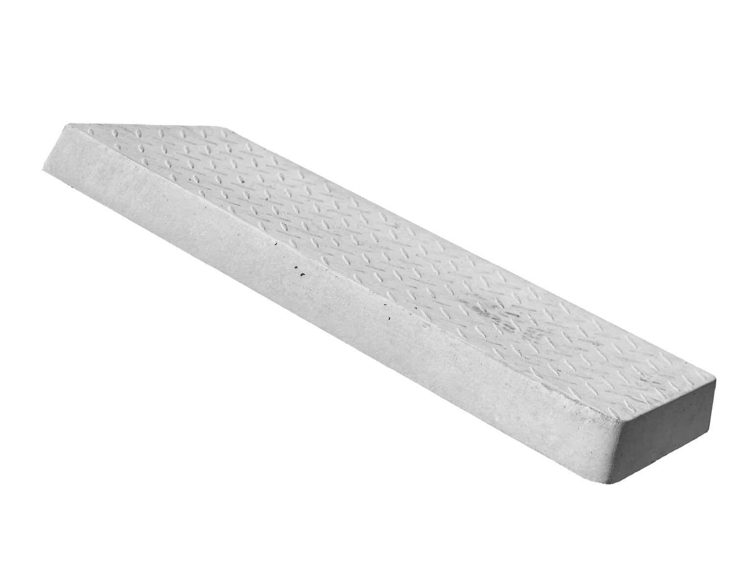 Precast concrete wheel stop with textured surface for parking lot safety and durability.