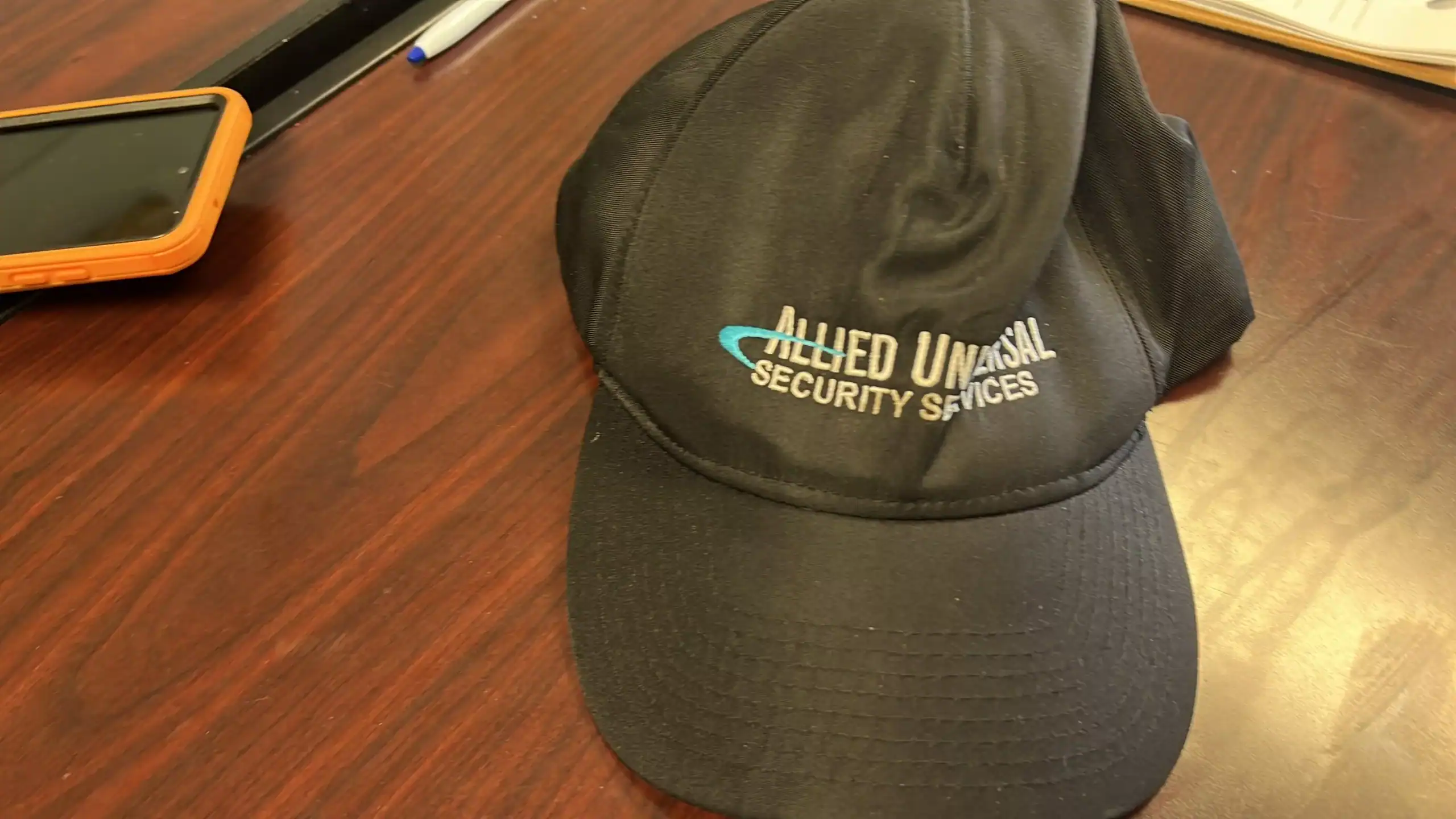 Allied Universal security guard Tennile Coleman's hat at the Palm Beach County Community Services Department GCNN Good Citizen News Network goodcitizennewsnetwork.com News That's Not Fake