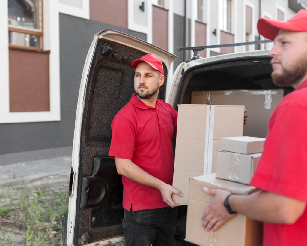 Movers in Strathmore loading boxes into a van for a move.