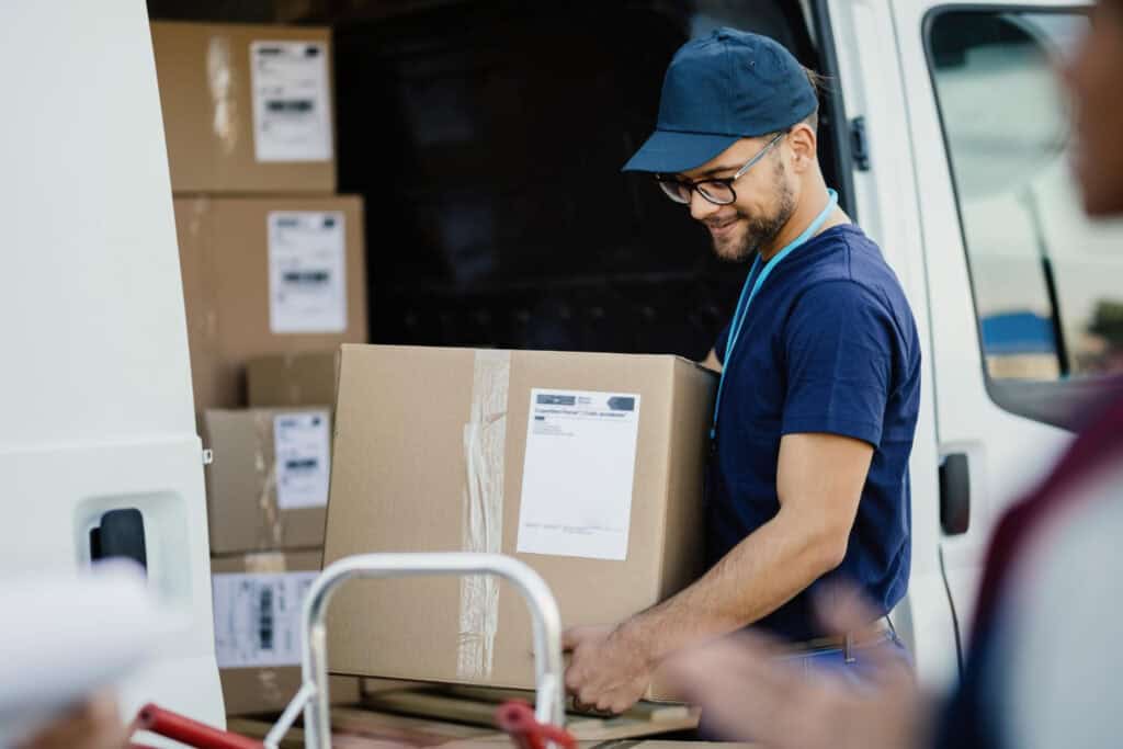 Mover loading boxes into a van for local moving services in Strathmore.