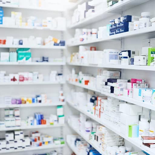 Pharmacy shelves stocked with medications at Grover Gastro and Fertility Centre.
