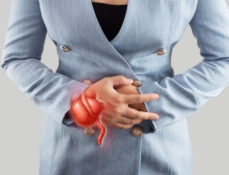 Woman holding her lower abdomen with an illustration of the appendix.