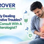 Man experiencing stomach pain, consulting a gastroenterologist for digestive issues.