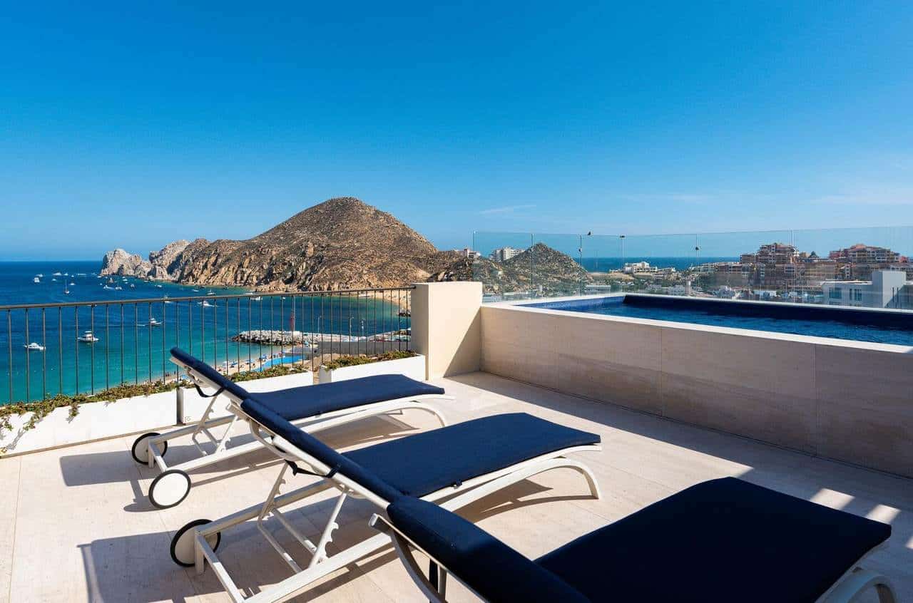 Luxury Ocean View Terrace At Hacienda With Modern Lounge Chairs Overlooking The Sea And Rugged Coastline. Perfect For Relaxing And Enjoying Stunning Sunset Vistas.