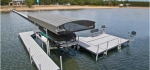 Covered boat slip with pontoon boat at Hall's Sport Center marina.