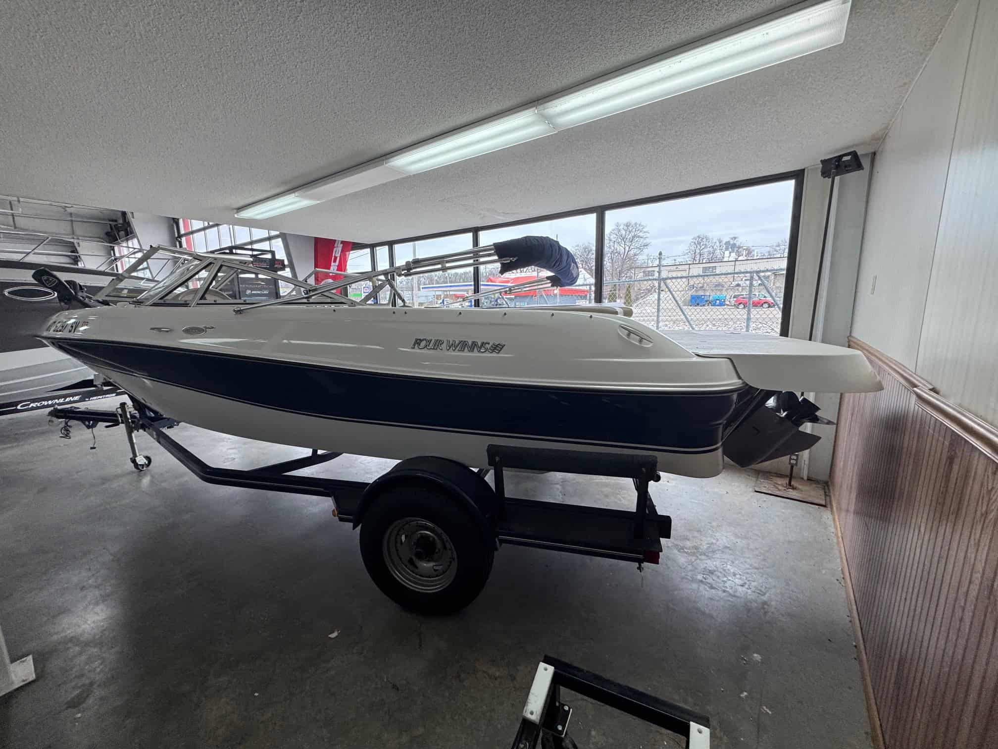 Four Winns Horizon 203 boat at Hall's Sport Center showroom.