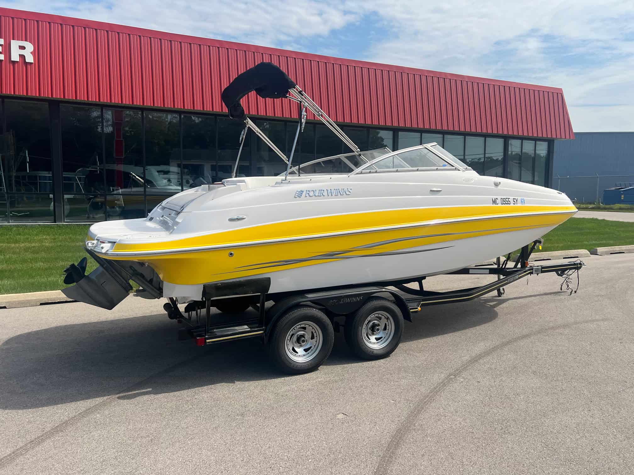 Elegant 2006 Four Winns 204 Funship boat on trailer at Hall's Sport Center.