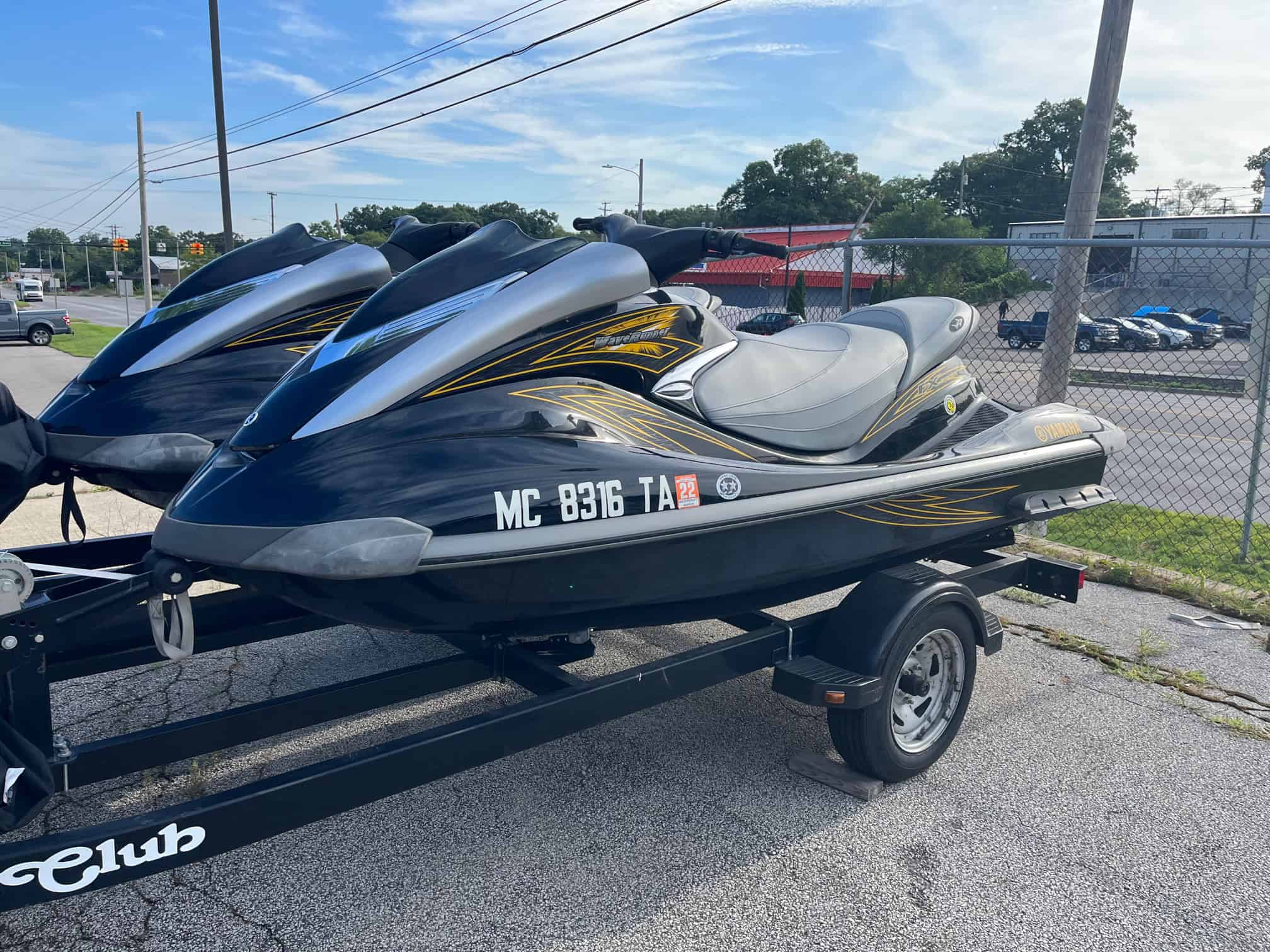 High-performance Yamaha jet skis on trailer at Hall's Sport Center.