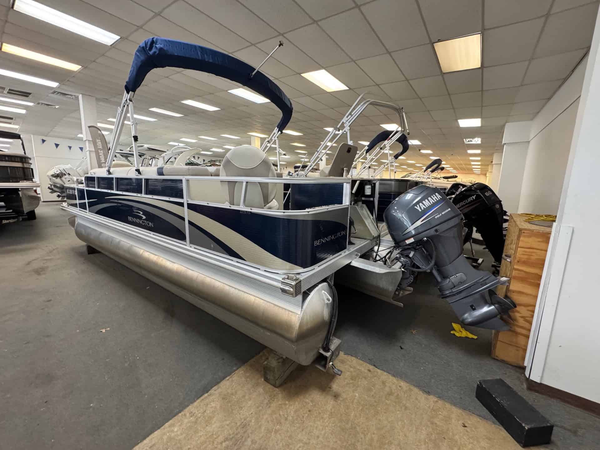Pontoon boat with Yamaha outboard motor at Hall's Sport Center.