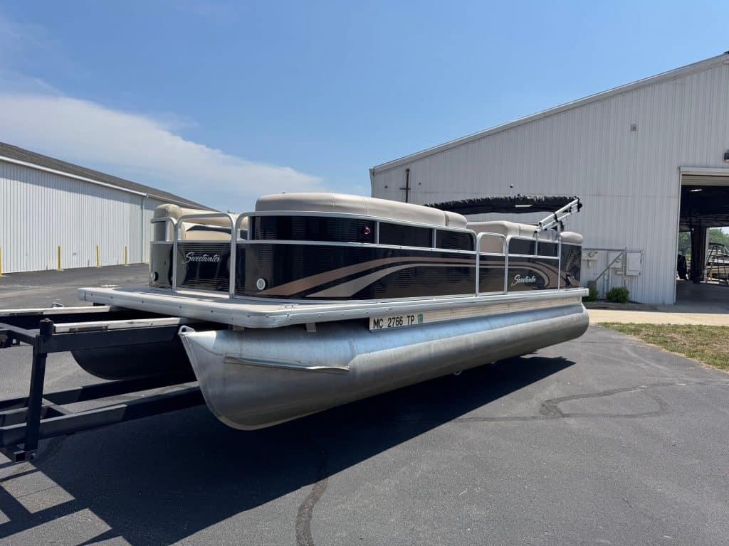 Pontoon boat for sale at Hall's Sport Center, perfect for water recreation and family outings.