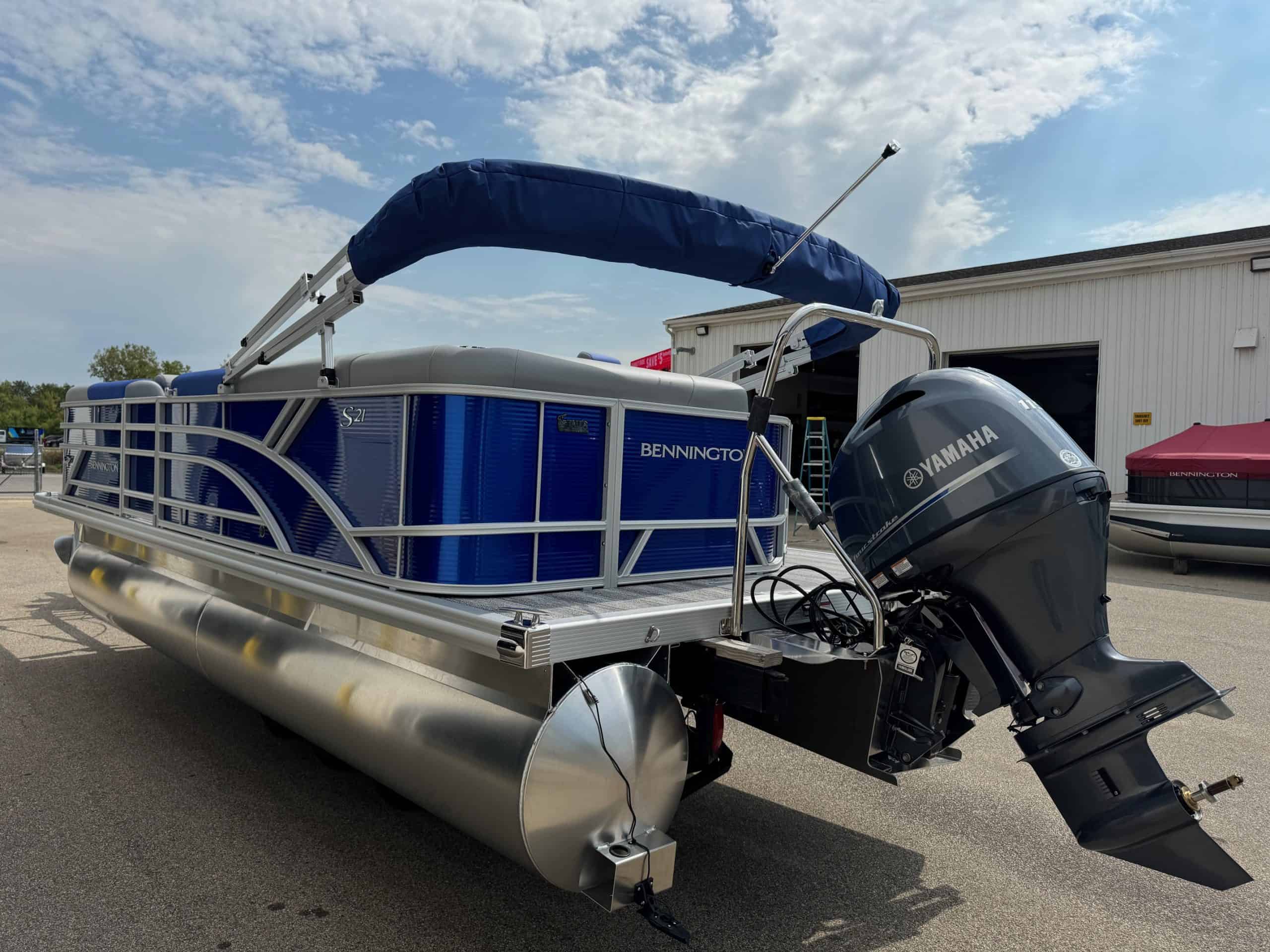 Bennington 21 SL pontoon boat with Yamaha outboard motor at Hall's Sport Center.