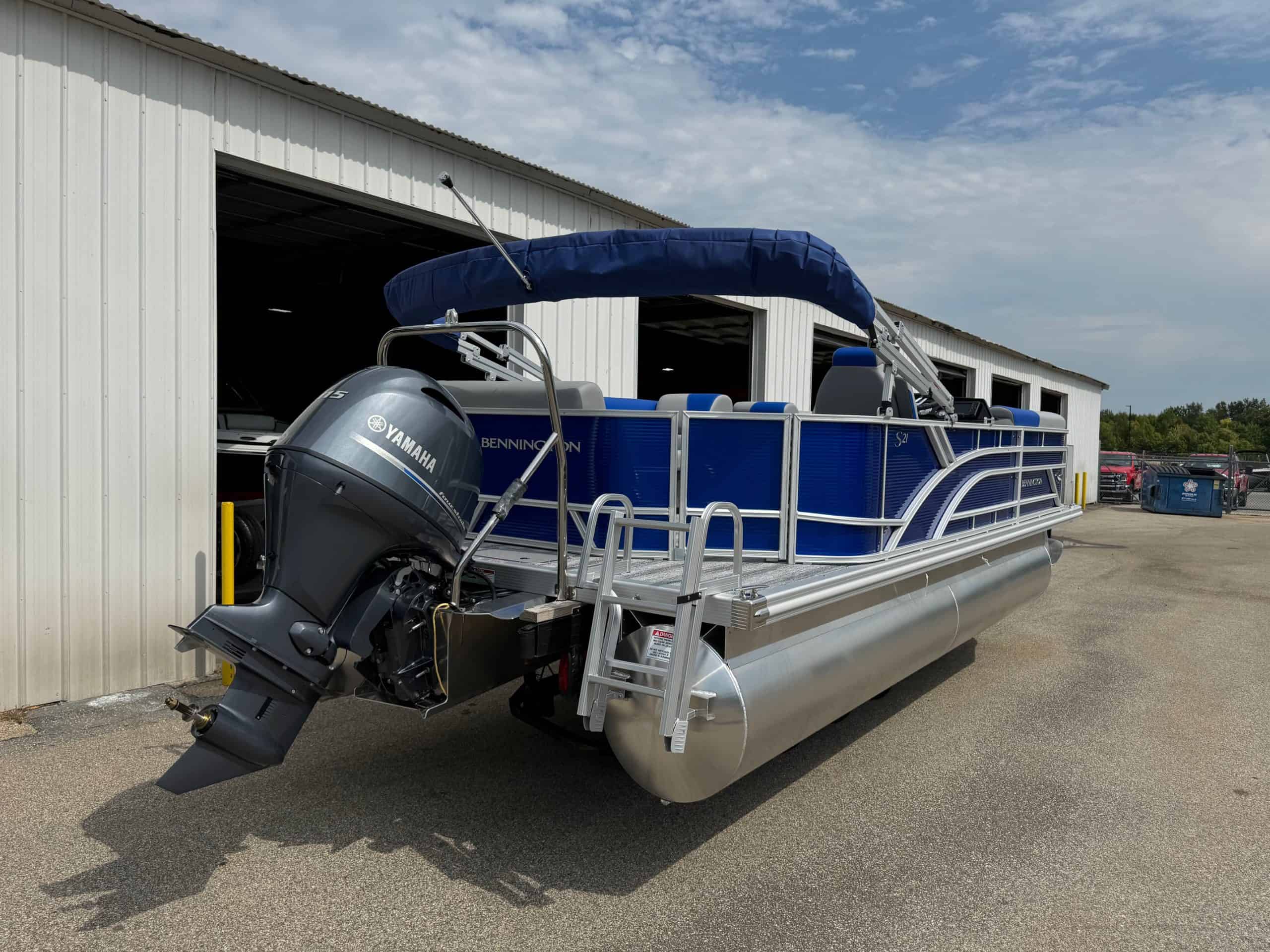 Bennington 21 SL pontoon boat with Yamaha engine at Hall's Sport Center. Perfect for family outings.