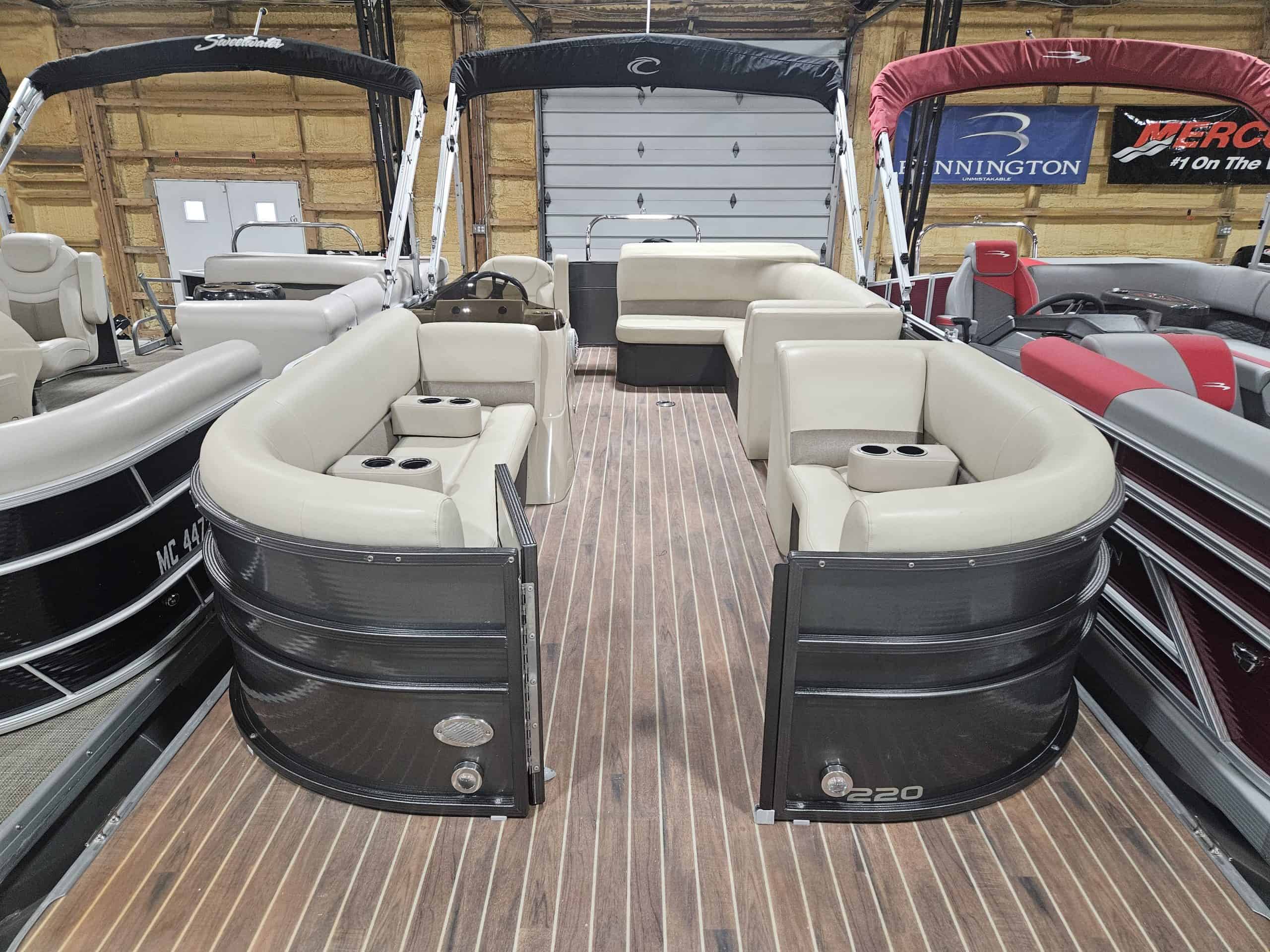 Crest 220 CPT pontoon boat at Hall's Sport Center, perfect for family outings.