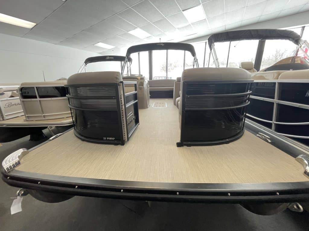 Pontoon boat with dual engines and spacious deck at Hall's Sport Center.