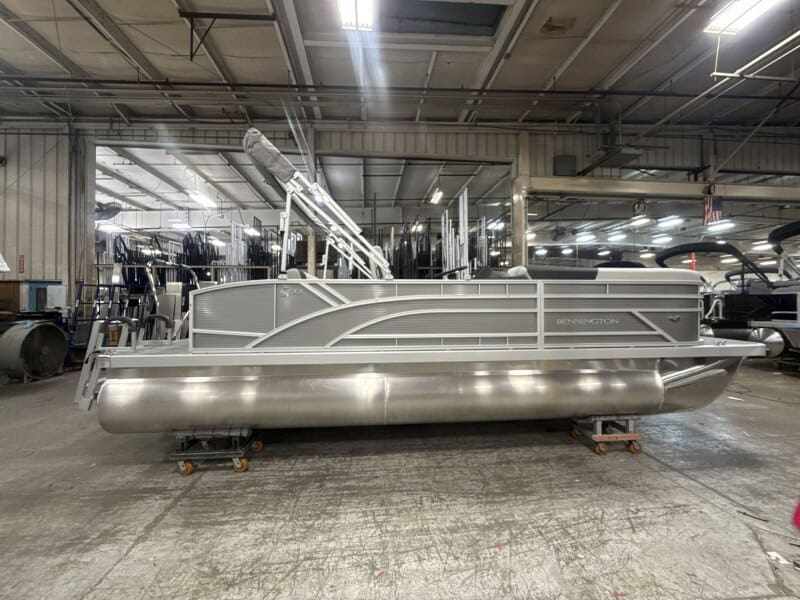 Bennington 22 S1-SSB pontoon boat displayed at Hall's Sport Center, ideal for boating enthusiasts.