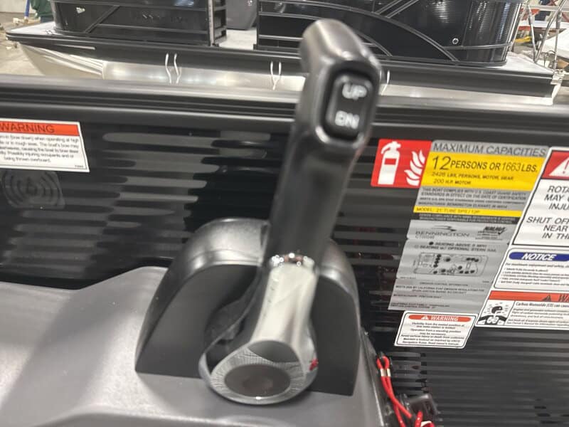 Bennington 22 S1-SSB boat control panel with throttle and steering wheel.