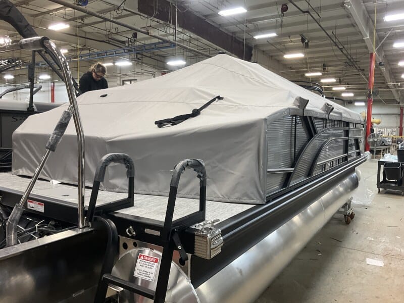 Bennington 22 S1SB pontoon boat displayed at Hall's Sport Center, perfect for family fun and water a.