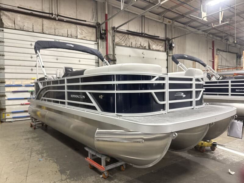Modern Bennington 22 SSR pontoon boat displayed at Hall's Sport Center showroom.