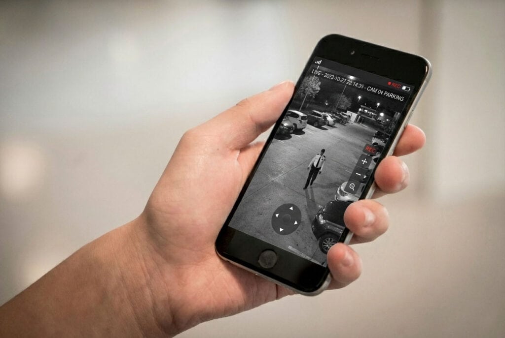 An image of an mobile phone displaying a live feed from a CCTV camera