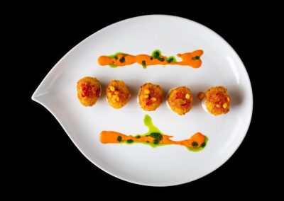 House Made Three Cheese Tater Tot With Chive Sour Cream And Jalapeño Jam