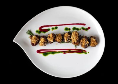 Roquefort Bleu Cheese Stuffed Date With A Candied Walnut Crust