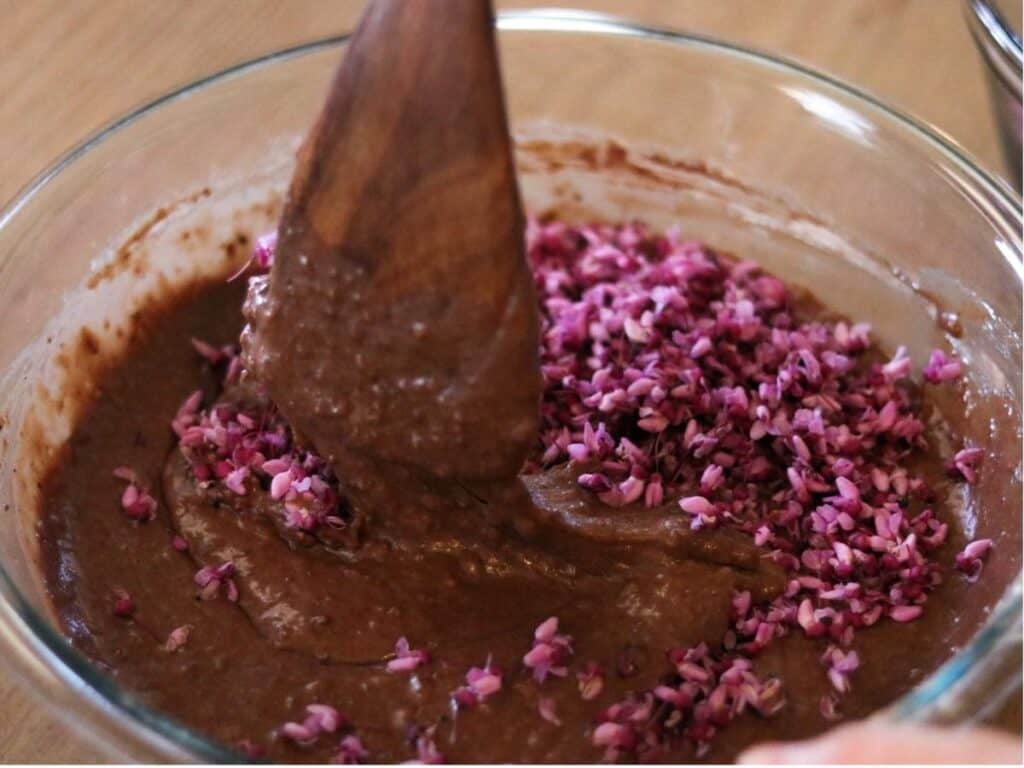redbuds being stirred into cake batter