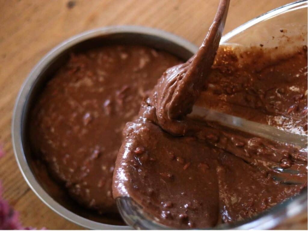 pouring cake batter into pan