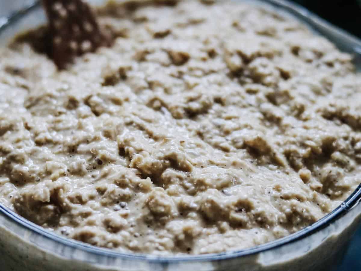 stirring uncooked soaked baked oatmeal