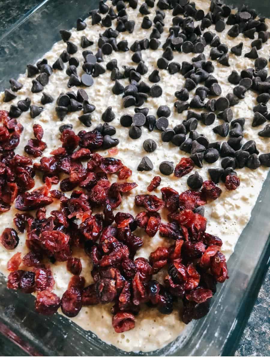 pan of uncooked baked oatmeal with cranberries and chocolate chips