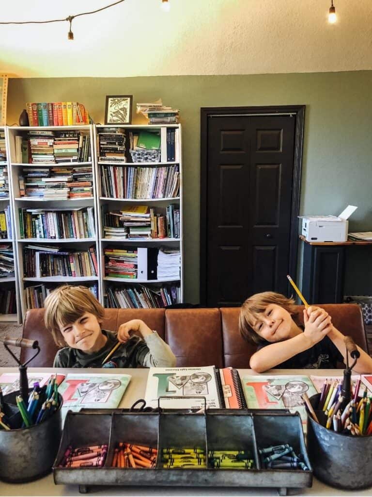 2 young boys homeschooling at the table