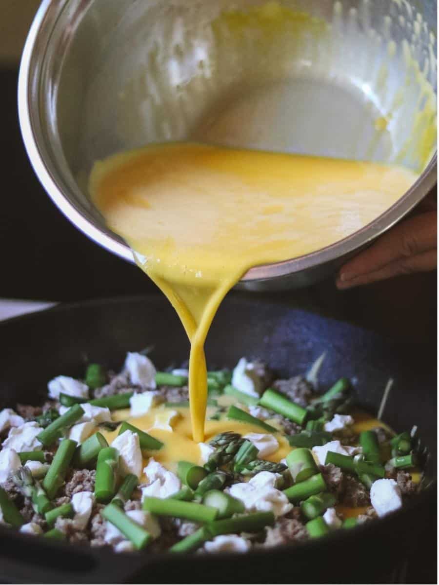 eggs pouring into a frittata