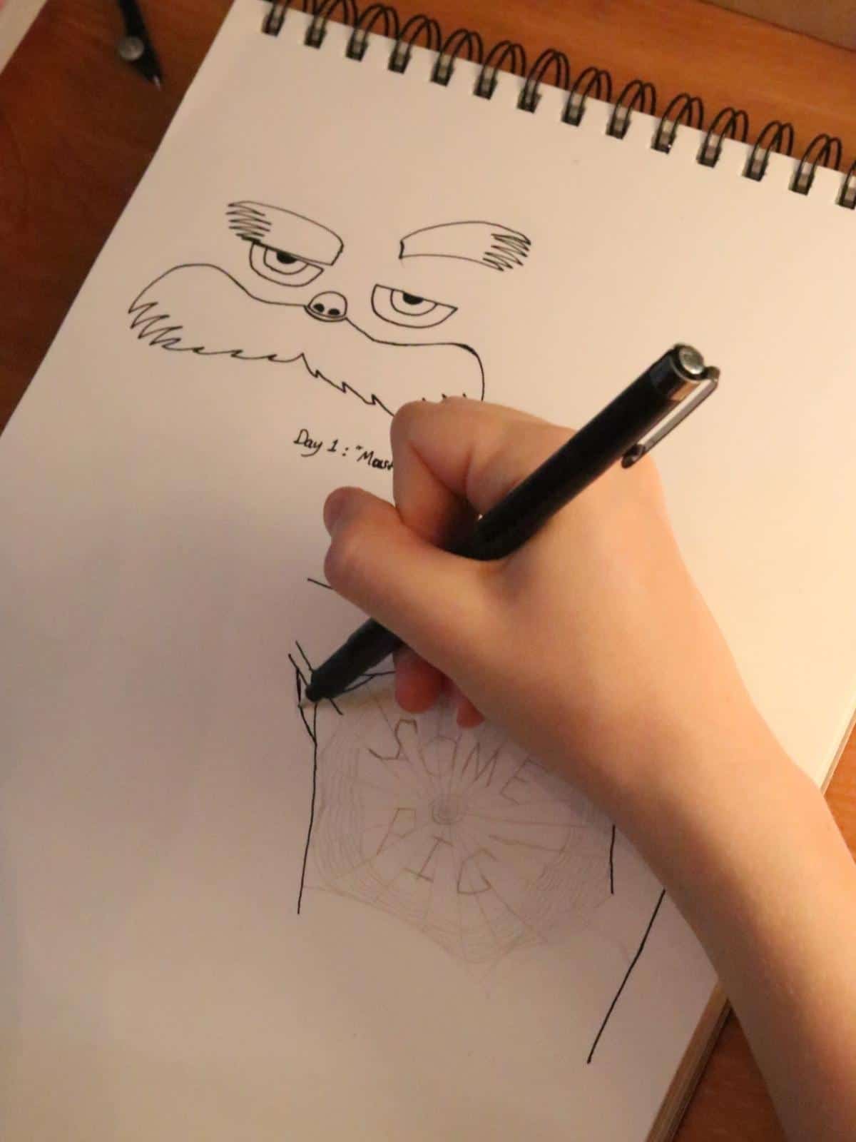 girl inking over a pencil underdrawing