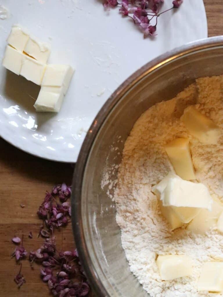 butter cubes in batter of redbud scones